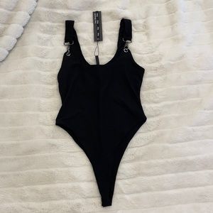 Black bodysuit with Buckle detailing.